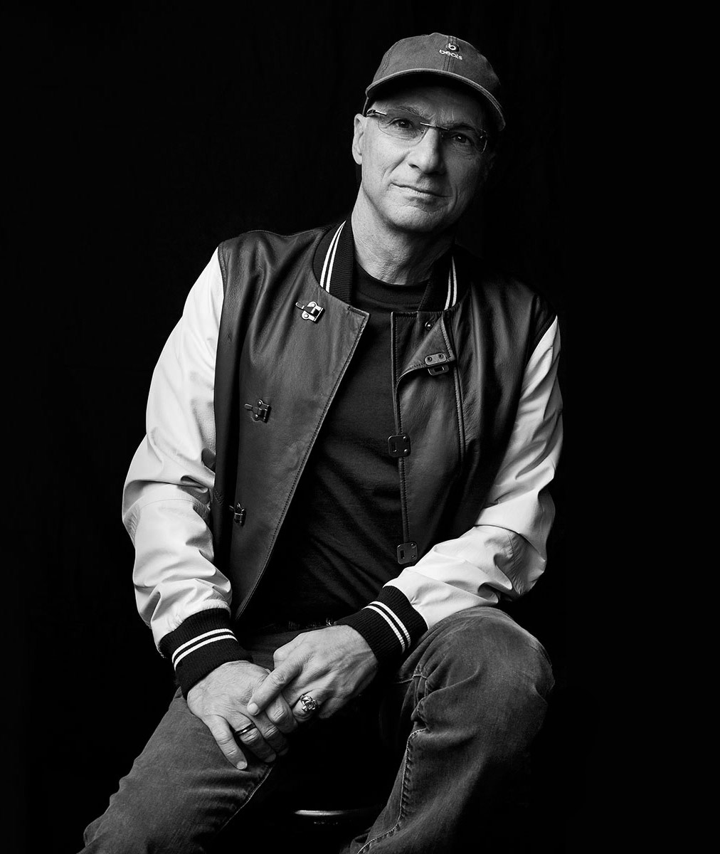 Jimmy Iovine sitting on a stool in black and white